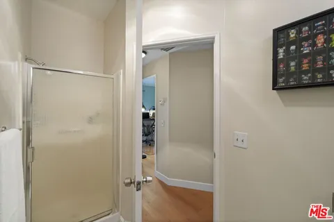 a bathroom with a glass shower door