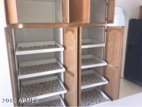 22735 West Patton Road Wittmann, AZ 85361 - Photo 3 of 35 Pull out shelves in pantry