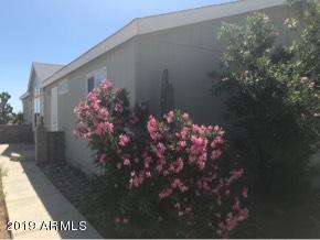 22735 West Patton Road Wittmann, AZ 85361 - Photo 9 of 35 walk way to front