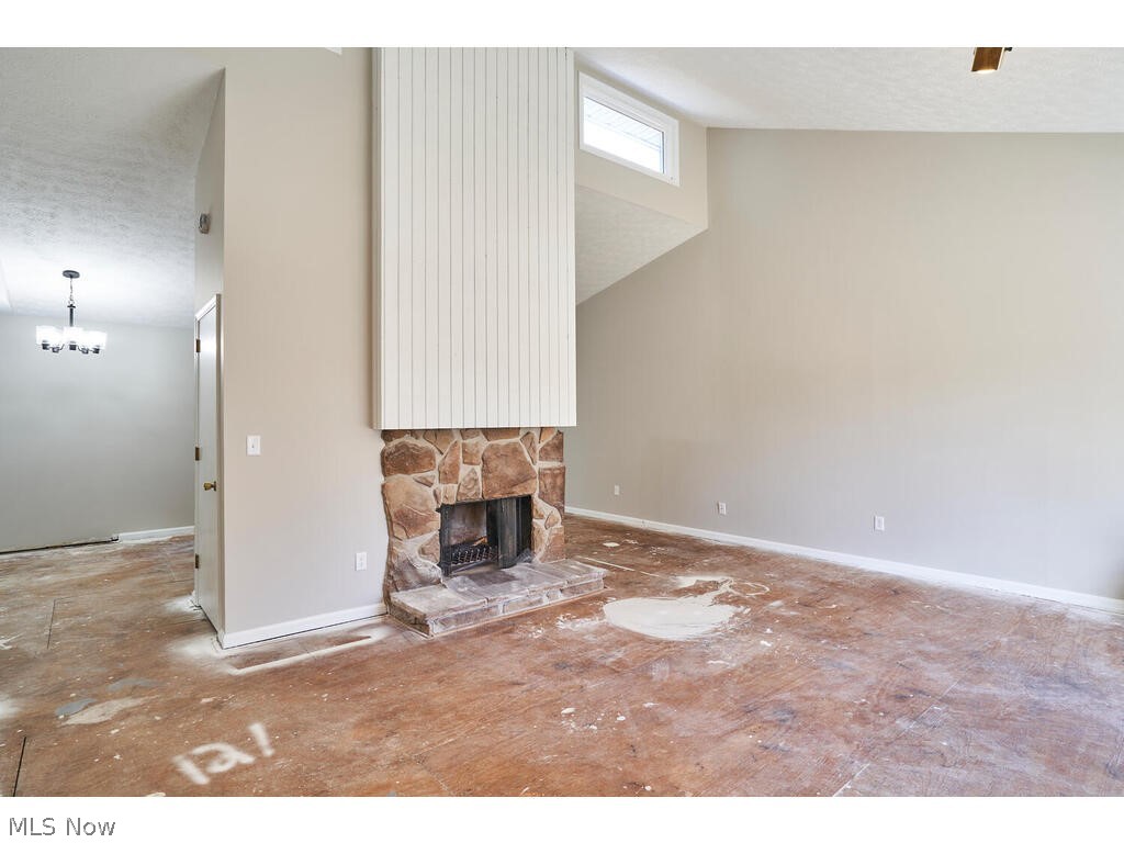 56 Winston Road Akron, OH 44313 - Photo 5 of 27 Fireplace separates the Great Room and Dining Room