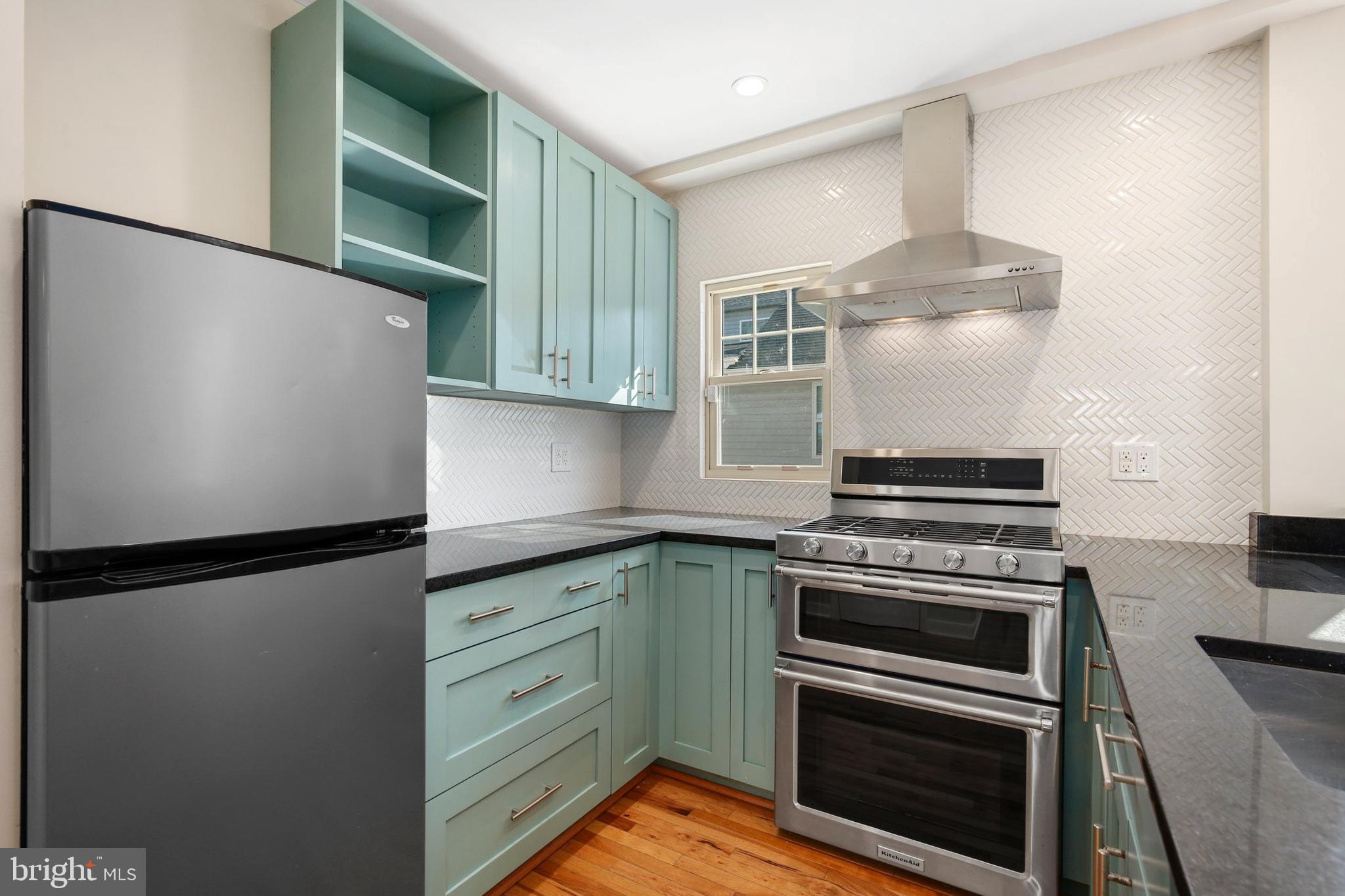 304 Marshall Street Gaithersburg, MD 20877 - Photo 14 of 38 a kitchen with appliances and cabinets