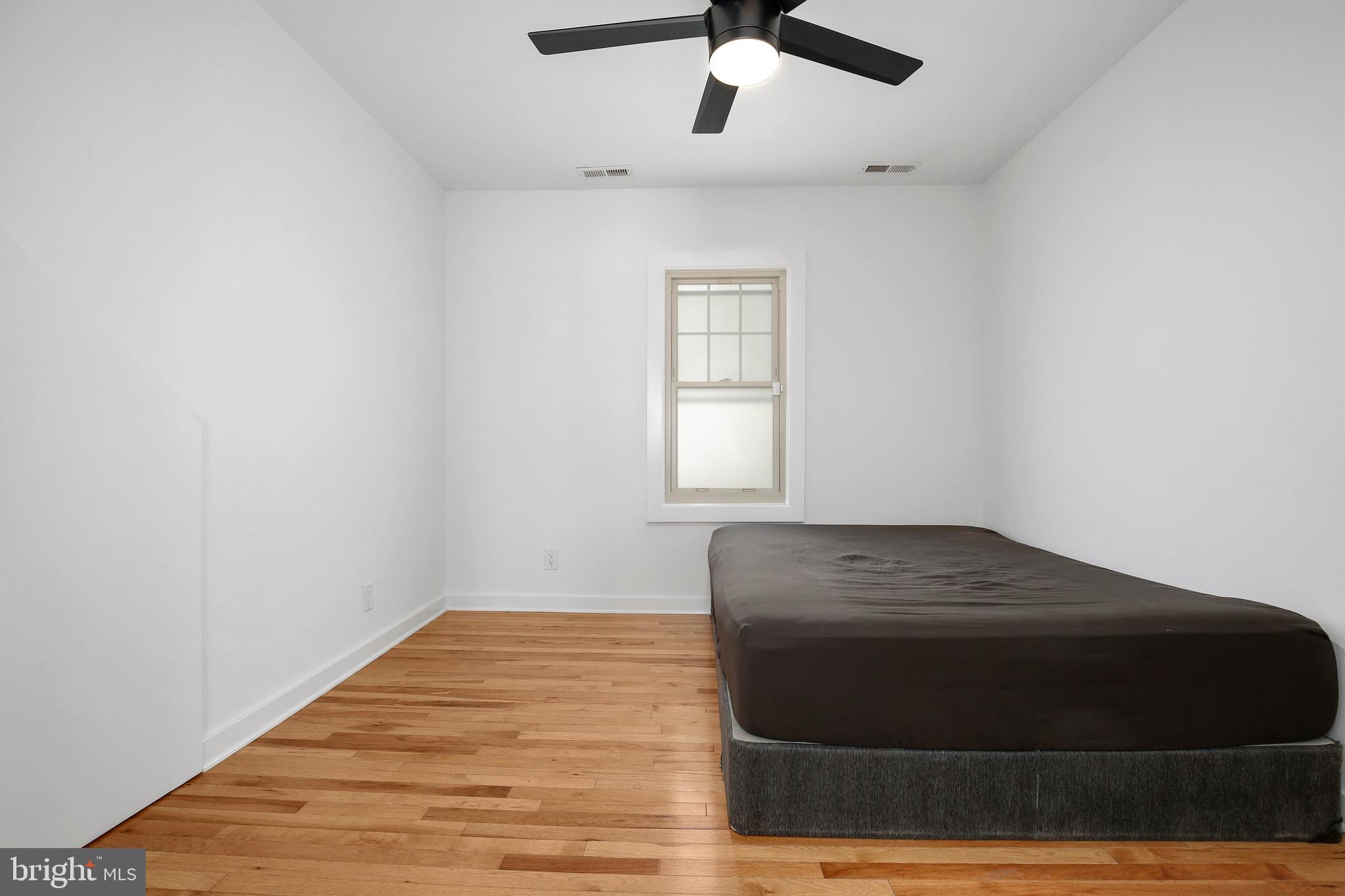 304 Marshall Street Gaithersburg, MD 20877 - Photo 19 of 38 a room with a bed and a window