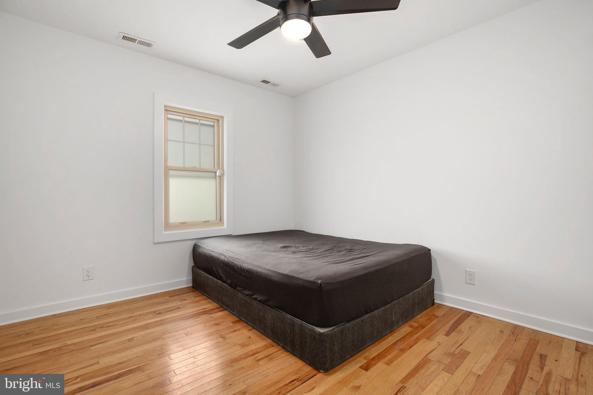 304 Marshall Street Gaithersburg, MD 20877 - Photo 20 of 38 a living room with a bed and a window