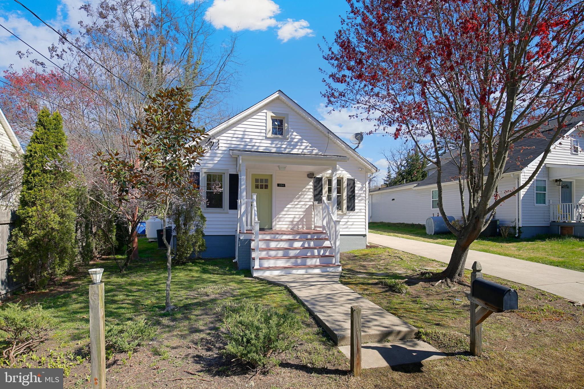 304 Marshall Street Gaithersburg, MD 20877 - Photo 2 of 38 a front view of a house with garden