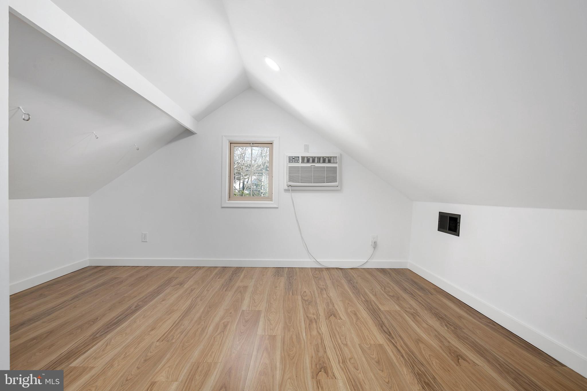 304 Marshall Street Gaithersburg, MD 20877 - Photo 27 of 38 an empty room with wooden floor and windows