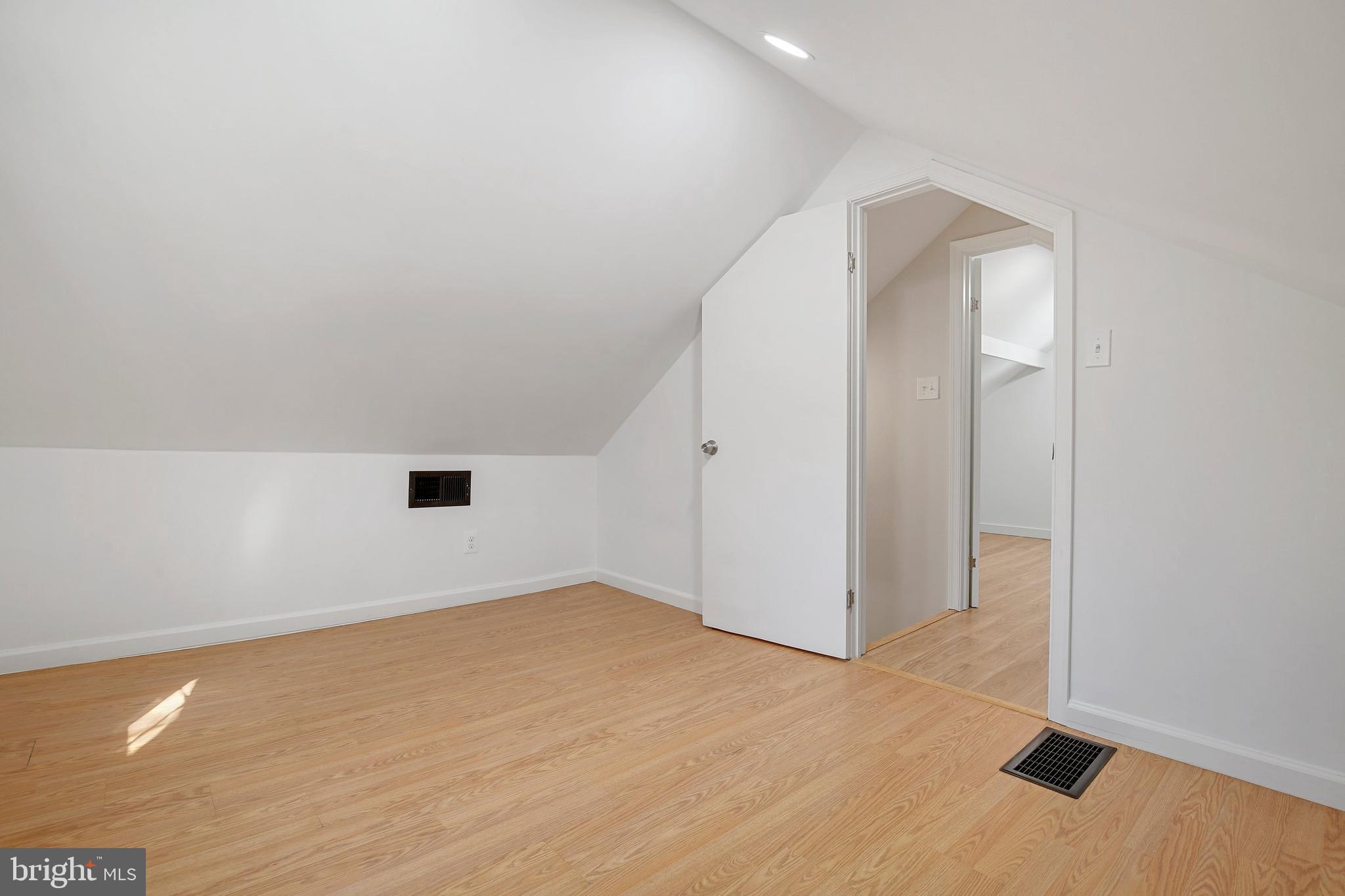 304 Marshall Street Gaithersburg, MD 20877 - Photo 30 of 38 an empty room with wooden floor and windows