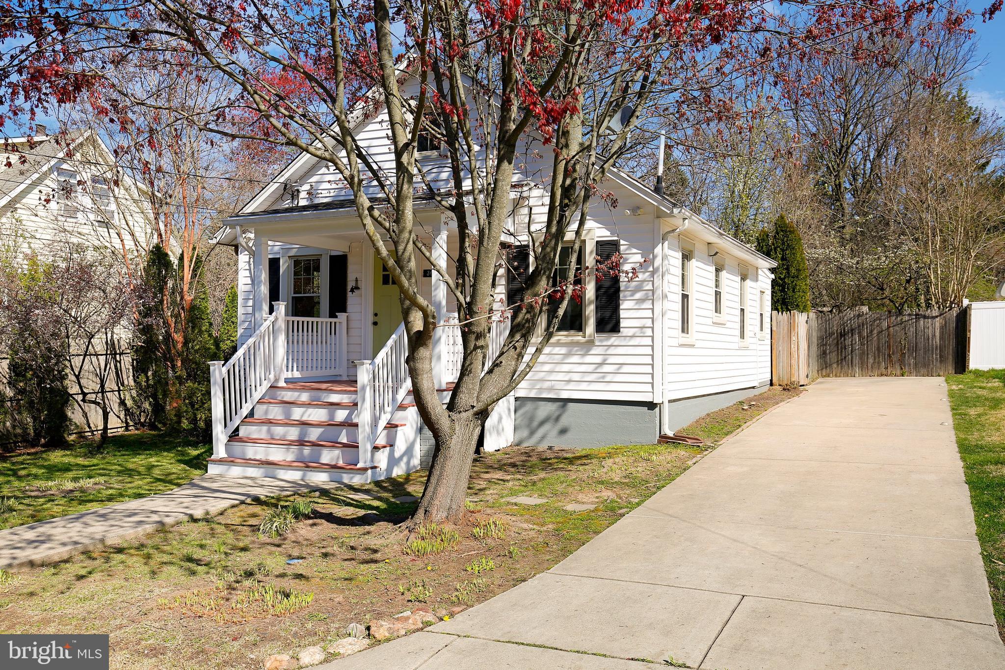 304 Marshall Street Gaithersburg, MD 20877 - Photo 3 of 38 a front view of a house with a yard