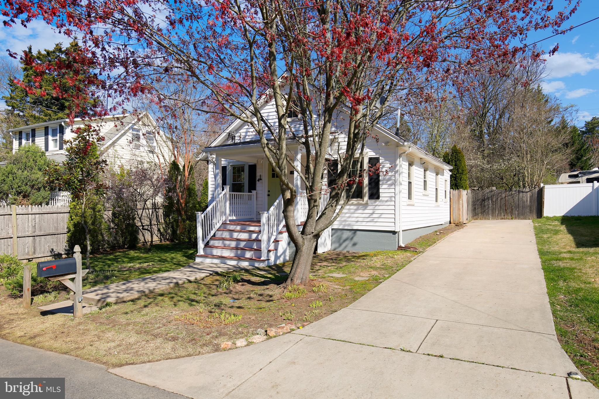 304 Marshall Street Gaithersburg, MD 20877 - Photo 36 of 38 a house with trees in front of it