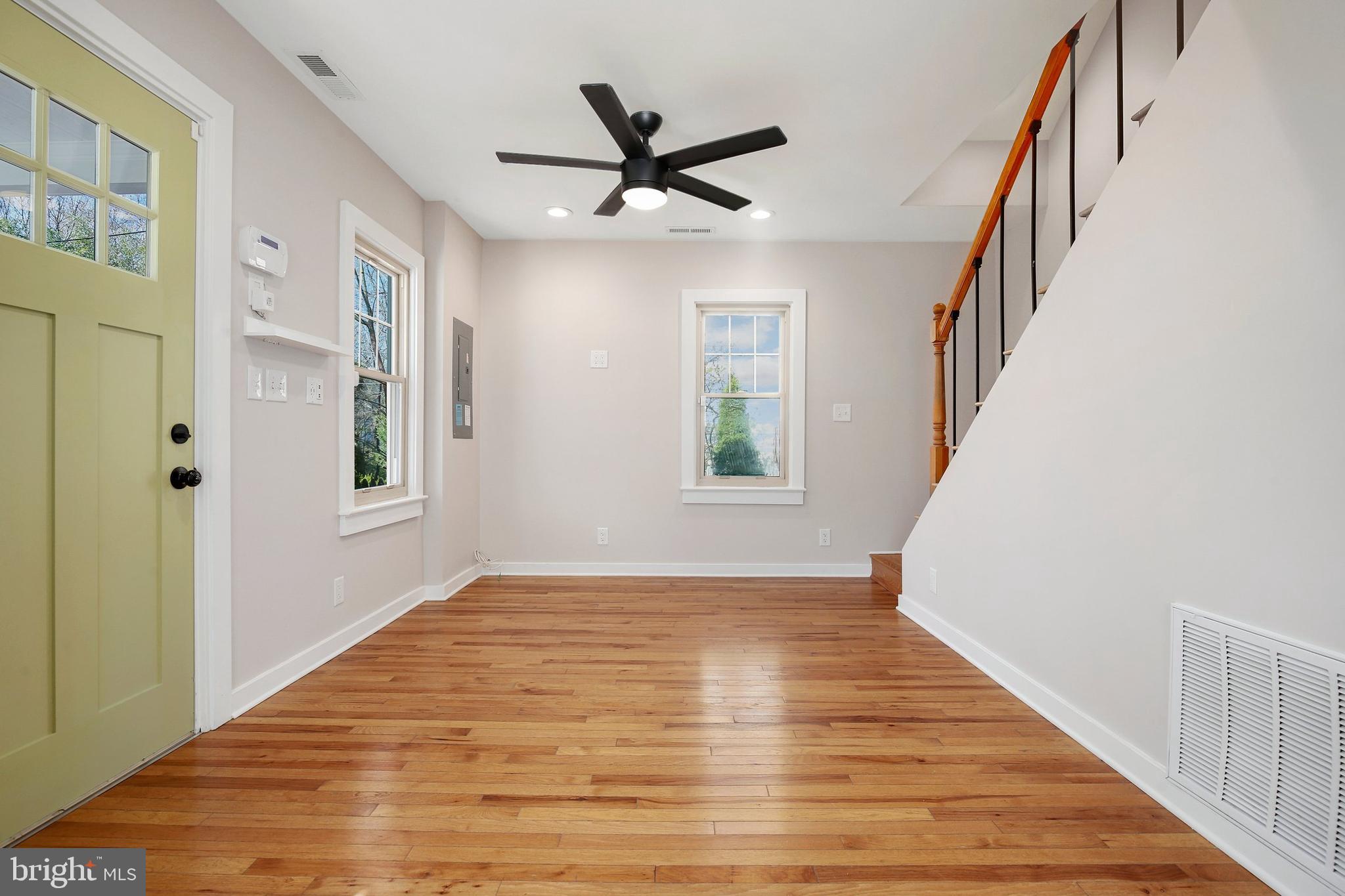 304 Marshall Street Gaithersburg, MD 20877 - Photo 6 of 38 a view of an empty room with wooden floor and a window