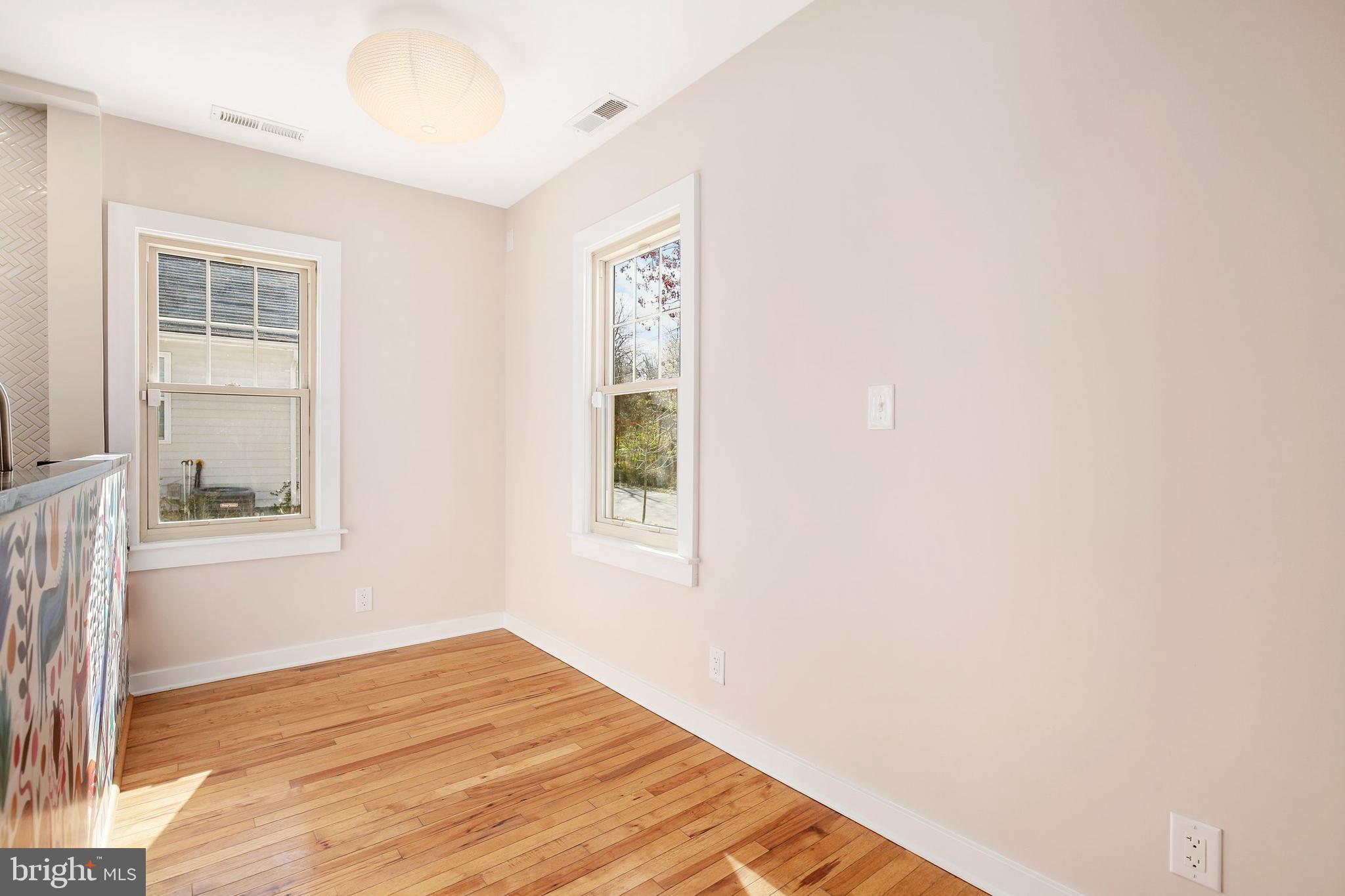 304 Marshall Street Gaithersburg, MD 20877 - Photo 10 of 38 a view of an empty room with wooden floor and a window