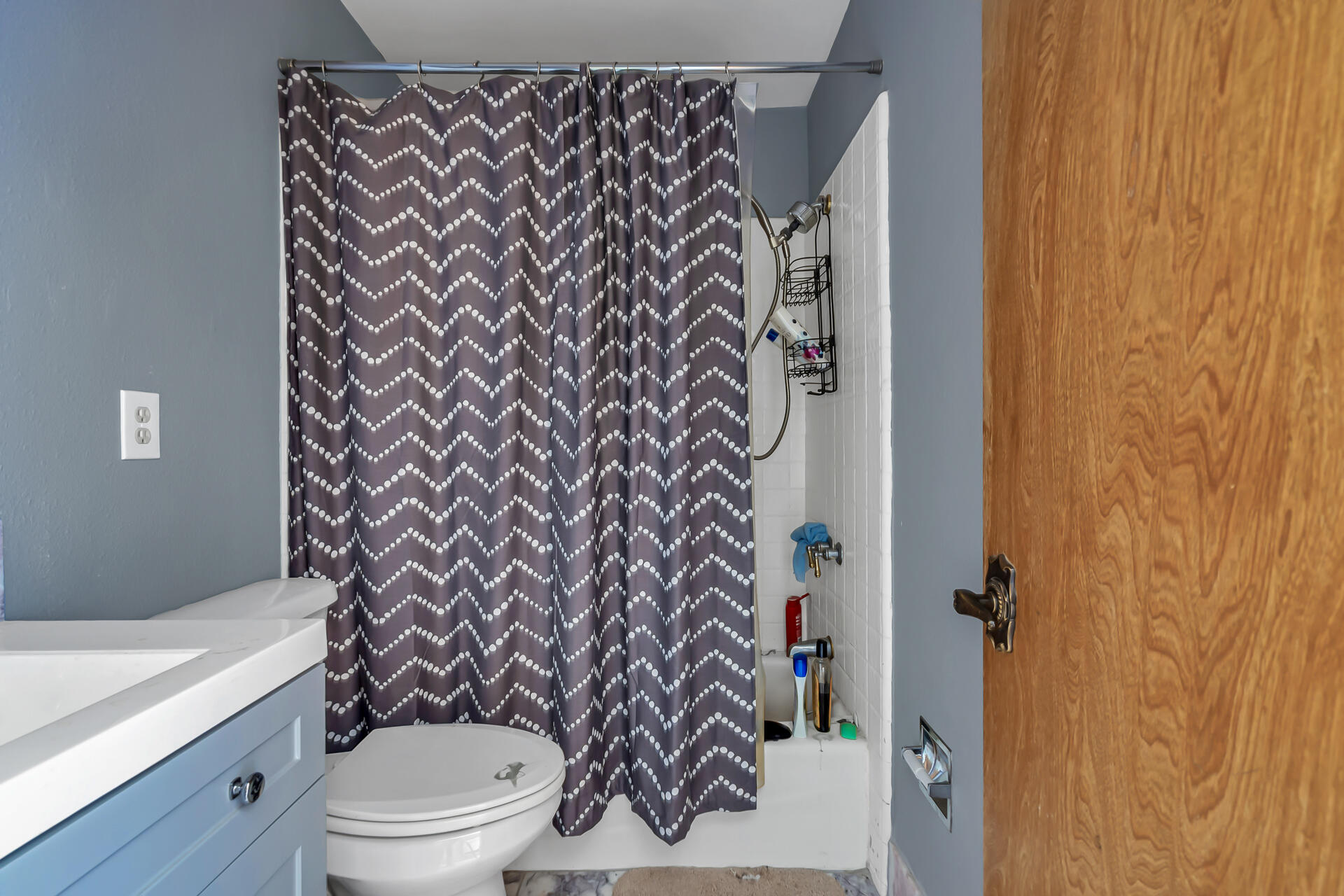 15368 Star Flower Road Oak Run, CA 96069 - Photo 47 of 63 a white toilet sitting next to a shower curtain