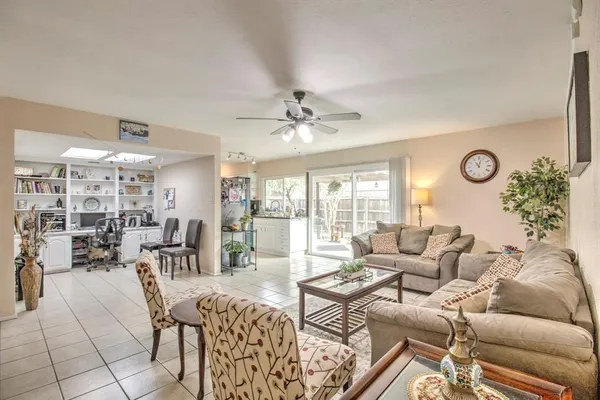 a living room with furniture and white walls