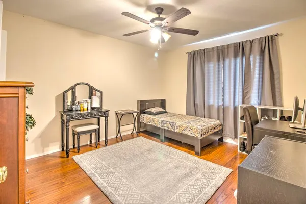 a living room with stainless steel appliances granite countertop furniture and a kitchen view