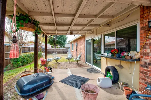 a outdoor living space with furniture and a fireplace