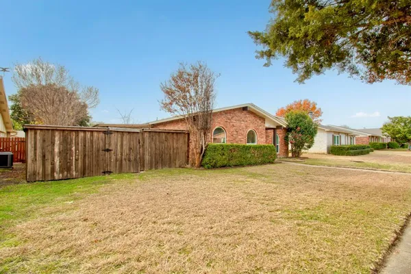 a front view of a house with yard