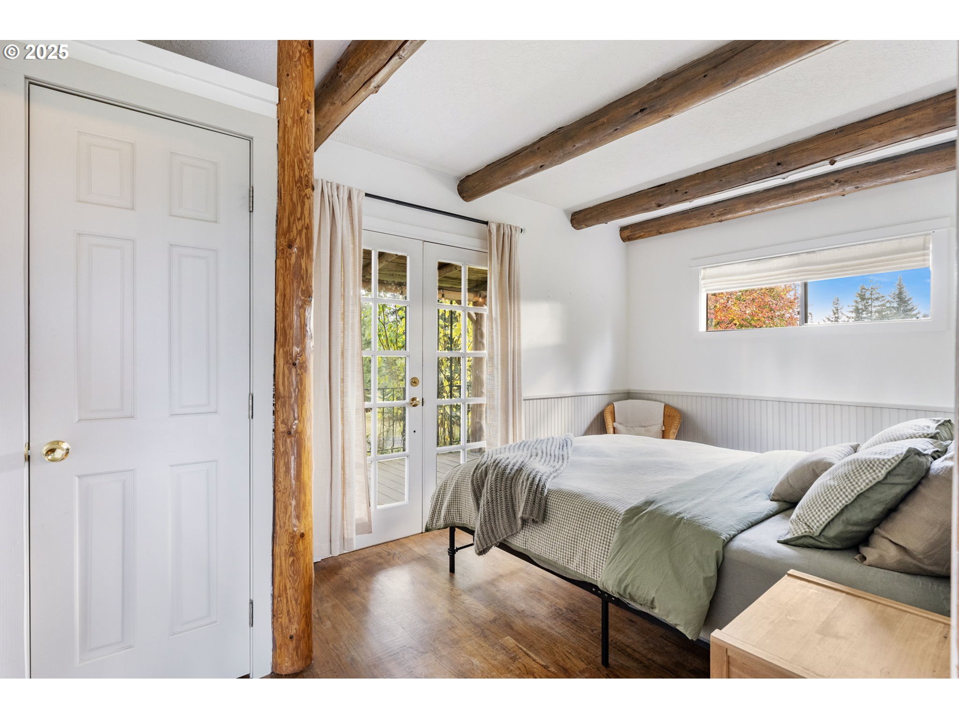 25751 Southeast Brian Ranch Road Sandy, OR 97055 - Photo 14 of 44 a bedroom with a bed and a large window