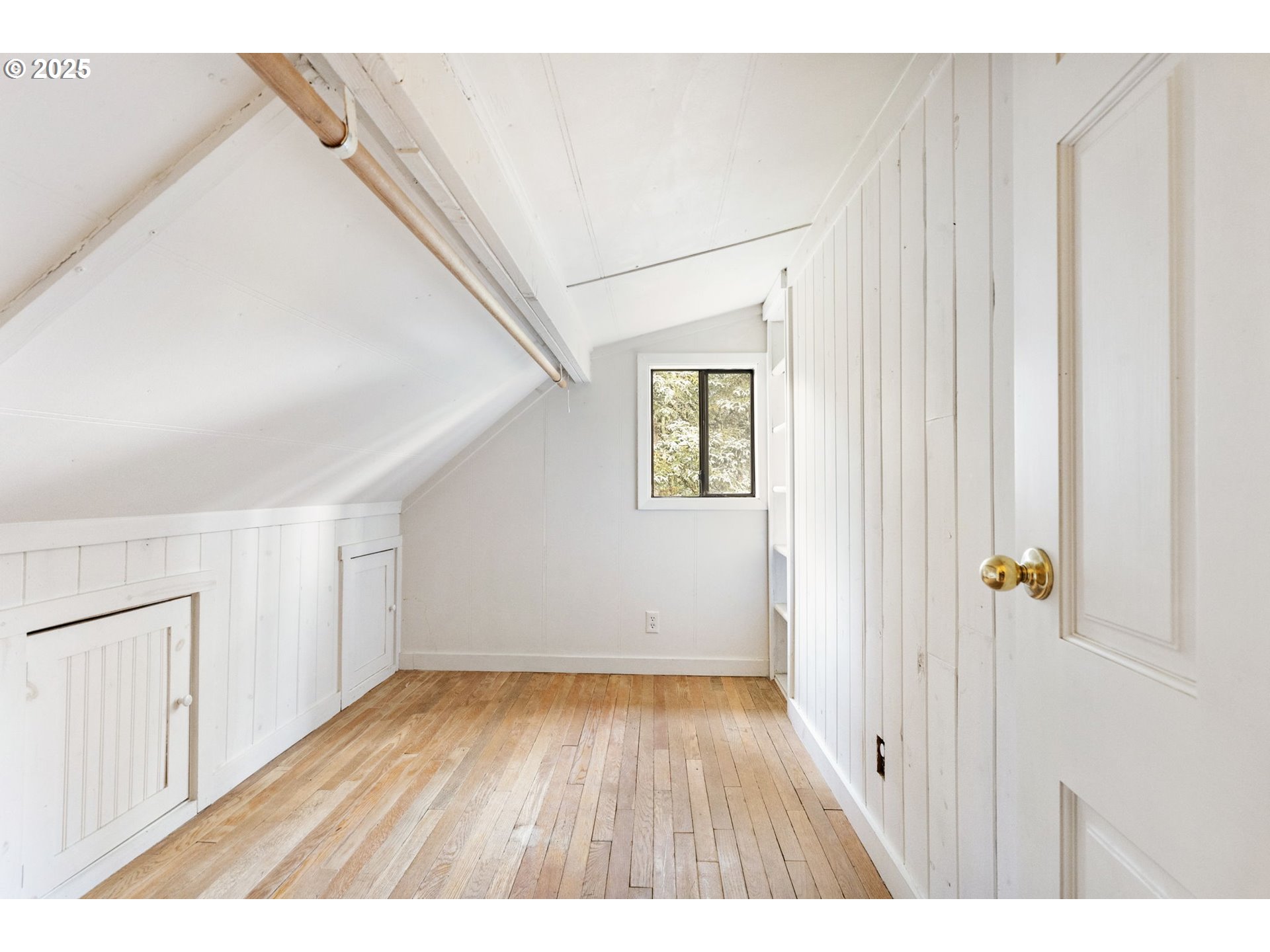 25751 Southeast Brian Ranch Road Sandy, OR 97055 - Photo 20 of 44 a view of an empty room with wooden floor and a window