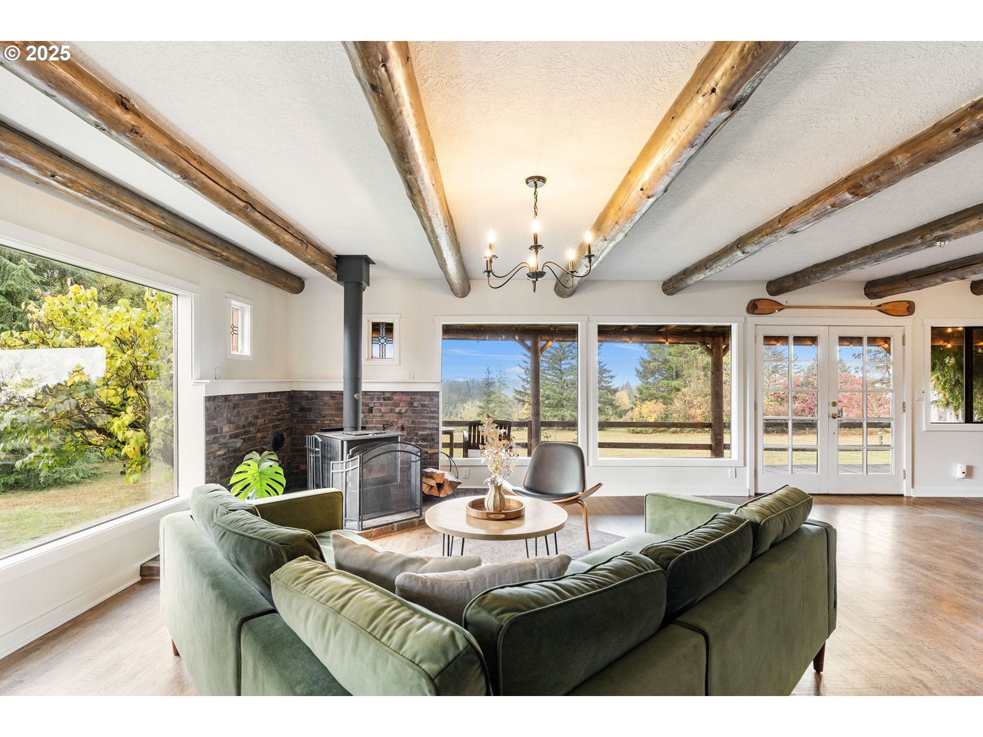 25751 Southeast Brian Ranch Road Sandy, OR 97055 - Photo 6 of 44 a living room with fireplace furniture and a large window