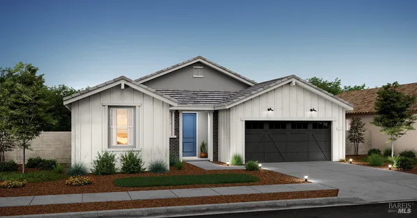 a front view of a house with garage