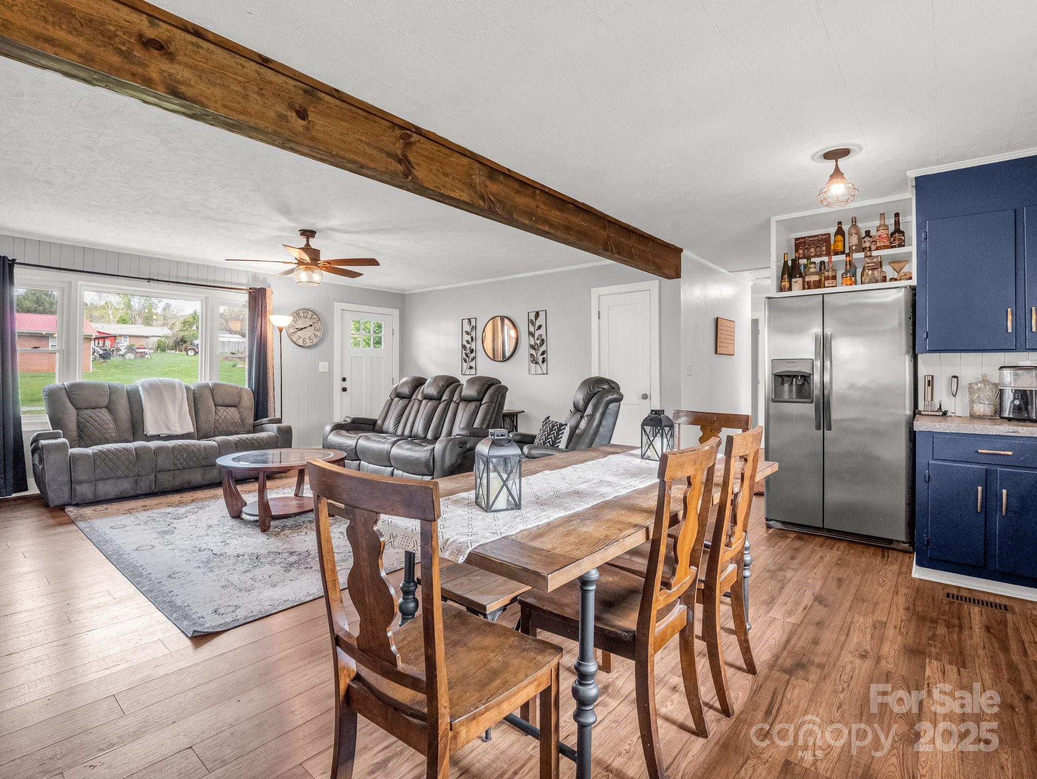 88 North Valley Street Marion, NC 28752 - Photo 11 of 43 a view of a dining room with furniture a kitchen and chandelier