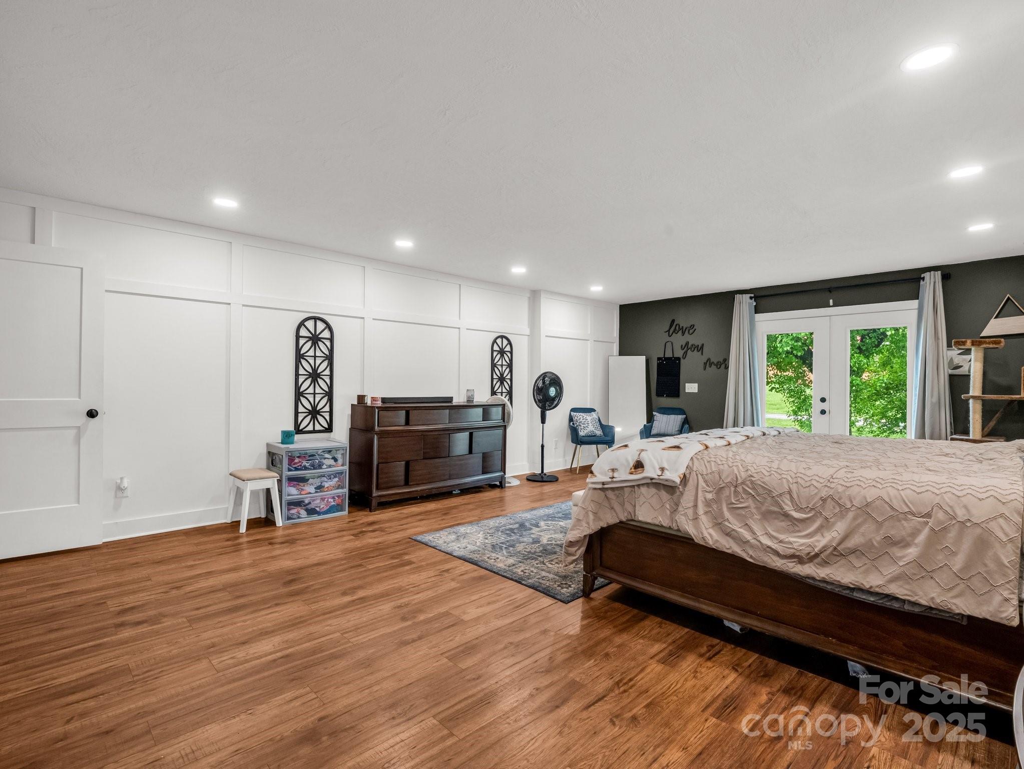 88 North Valley Street Marion, NC 28752 - Photo 16 of 43 a bed room with furniture and a wooden floor