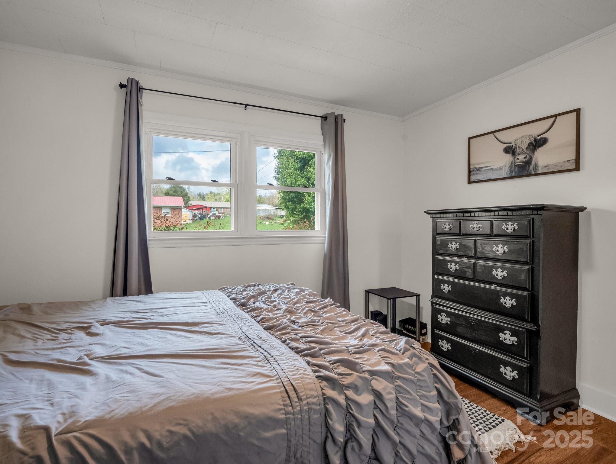 88 North Valley Street Marion, NC 28752 - Photo 19 of 43 a bedroom with a bed and a window