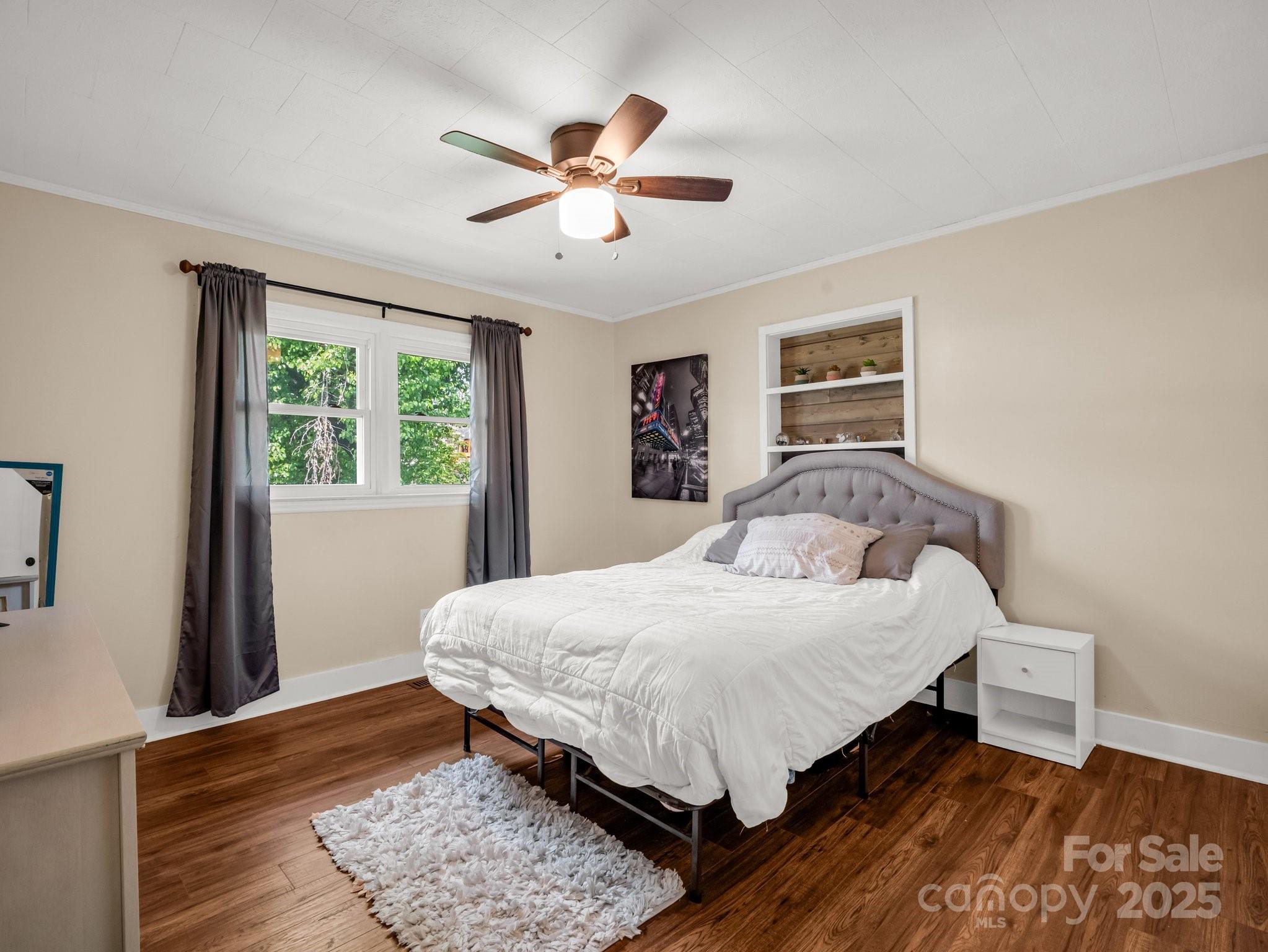 88 North Valley Street Marion, NC 28752 - Photo 21 of 43 a bedroom with a bed and a dresser