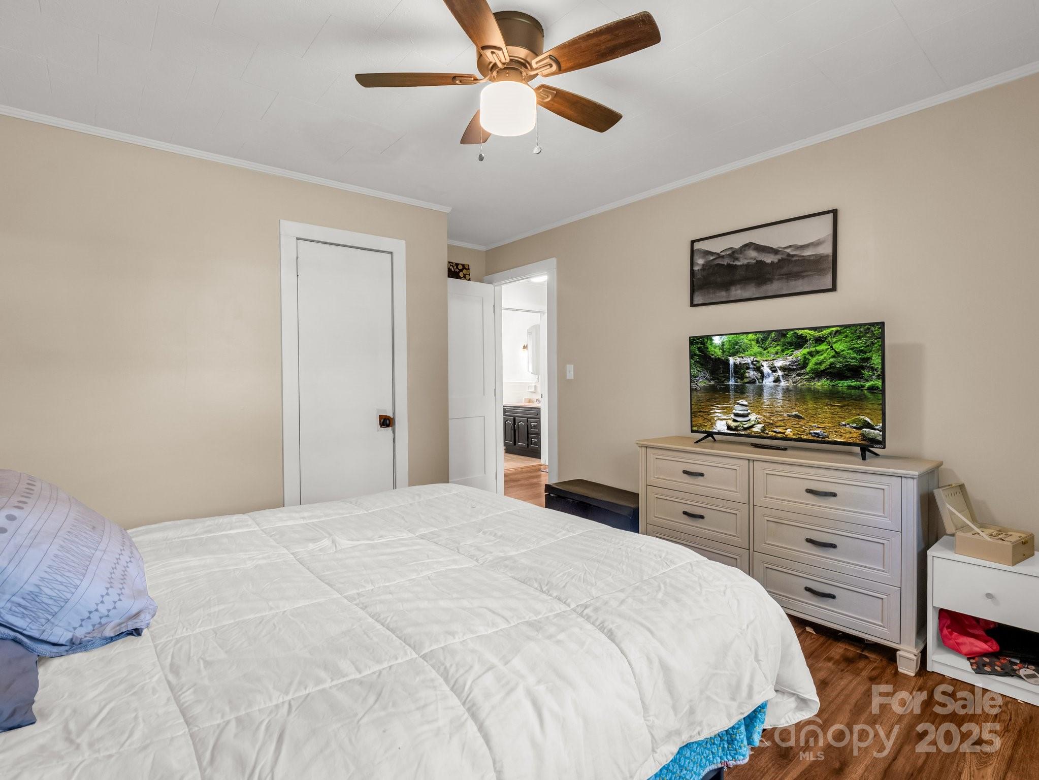 88 North Valley Street Marion, NC 28752 - Photo 22 of 43 a bedroom with a bed and a dresser
