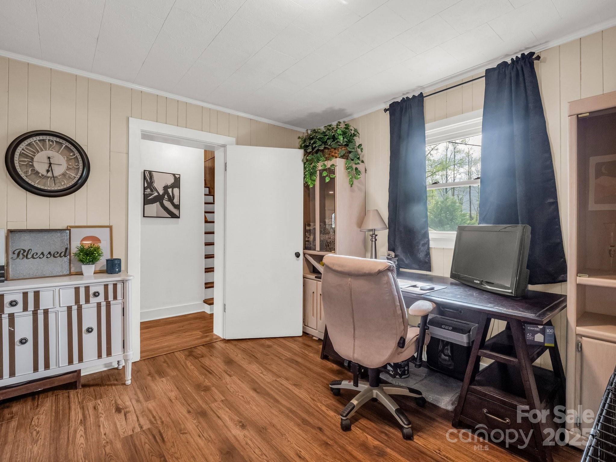 88 North Valley Street Marion, NC 28752 - Photo 23 of 43 a view of a workspace with furniture and a window