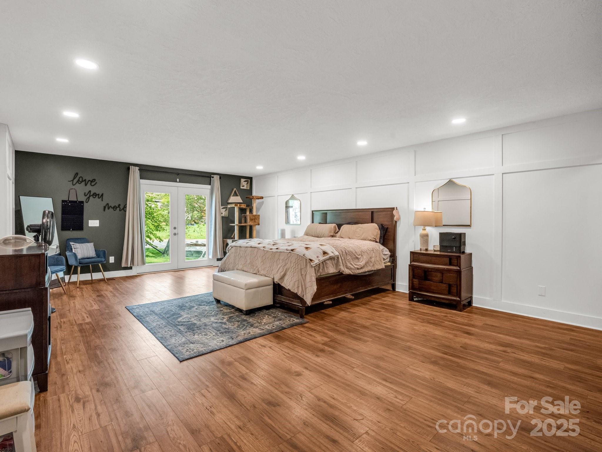 88 North Valley Street Marion, NC 28752 - Photo 3 of 43 a bedroom with furniture and a wooden floor
