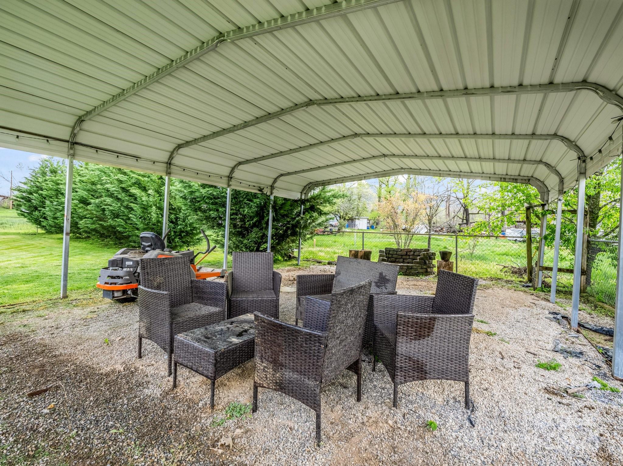 88 North Valley Street Marion, NC 28752 - Photo 34 of 43 a backyard of a house with a garden and outdoor seating