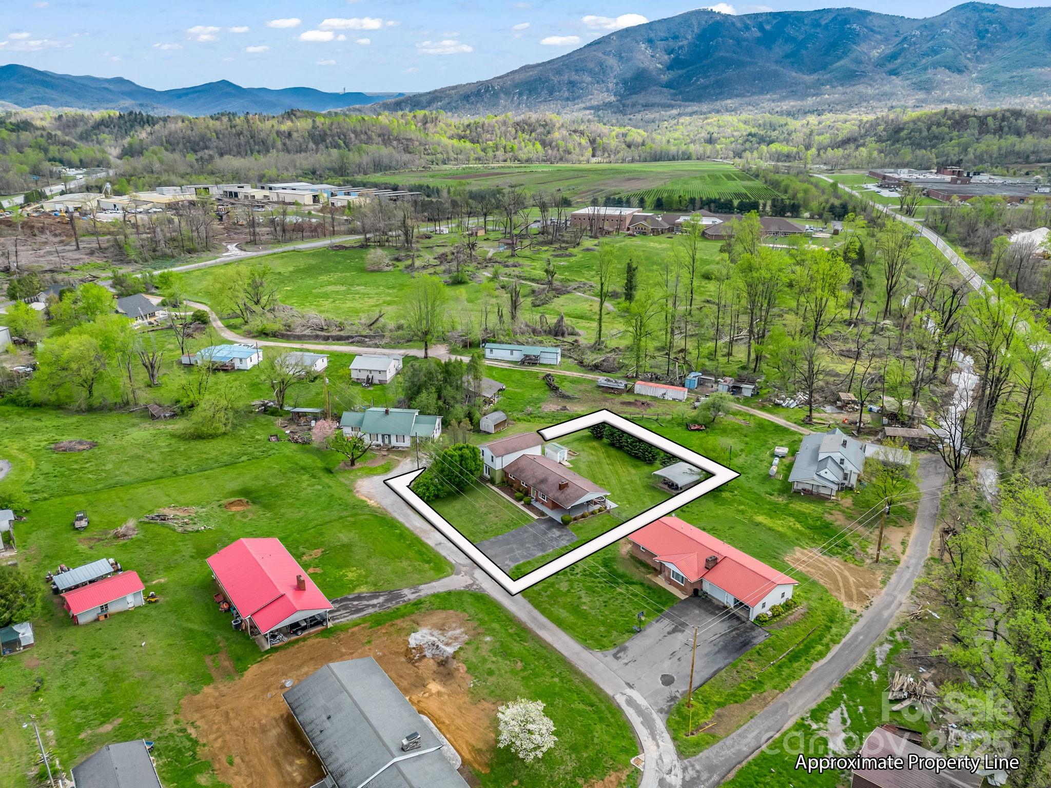 88 North Valley Street Marion, NC 28752 - Photo 38 of 43 an aerial view of a pool yard and mountain view in back