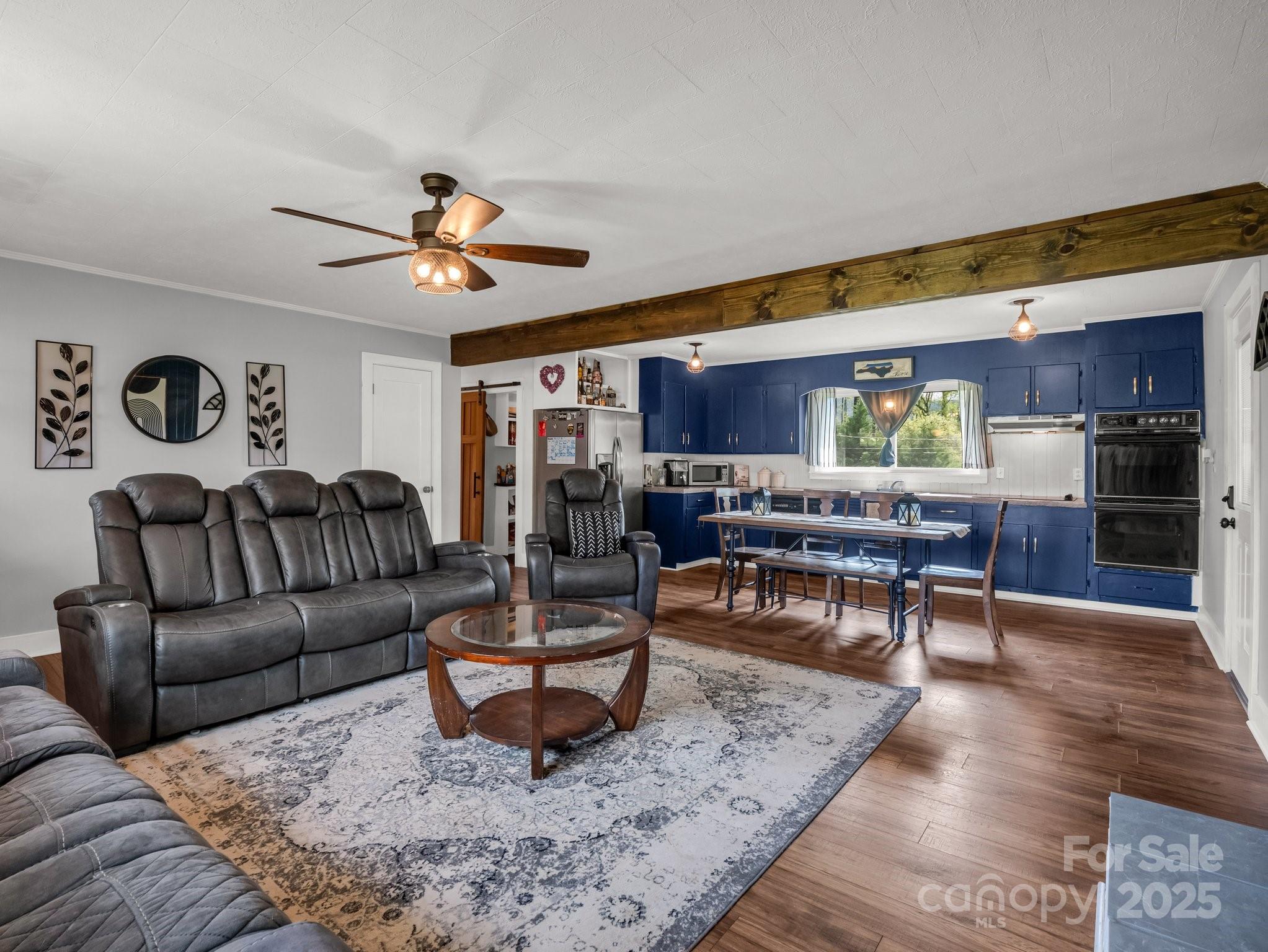 88 North Valley Street Marion, NC 28752 - Photo 6 of 43 a living room with furniture and wooden floor