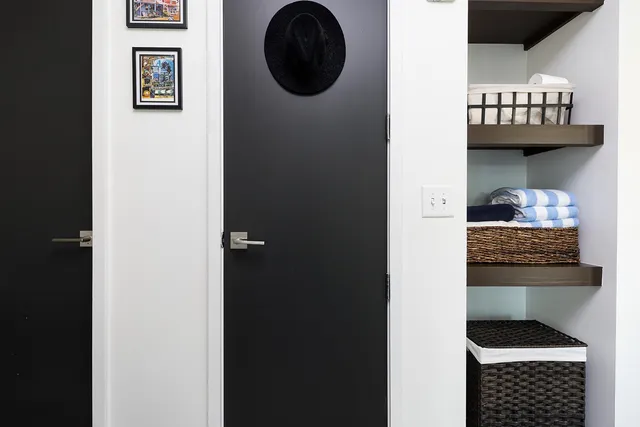 a white toilet sitting next to a shower curtain