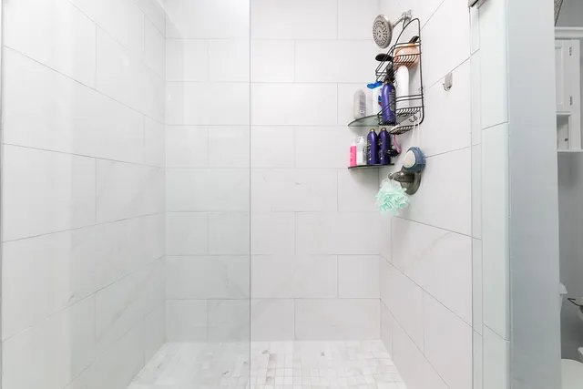 a bedroom with furniture and a flat screen tv