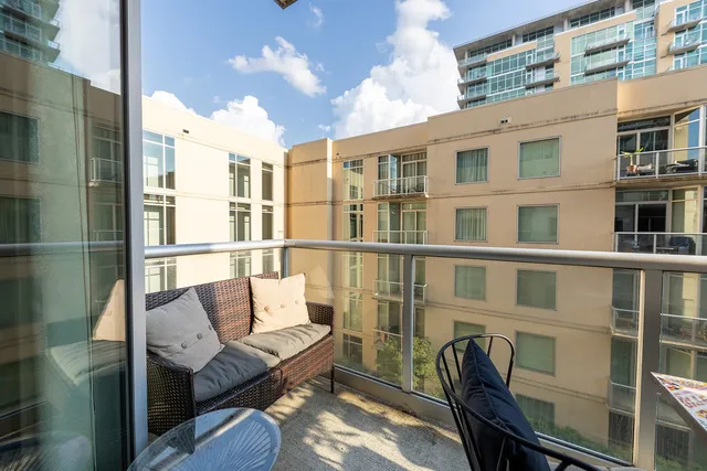 a lobby with furniture and rug
