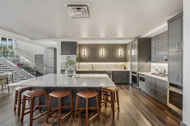 a kitchen with a table and chairs in it
