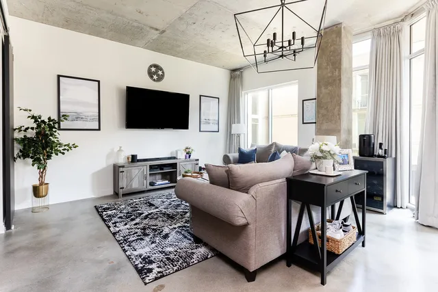 a living room with furniture and a flat screen tv