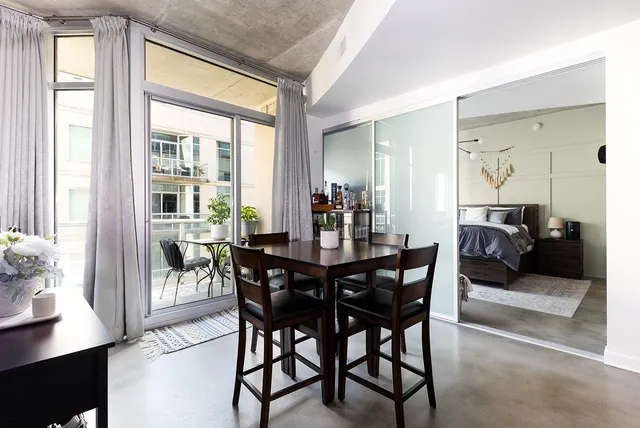 a view of a dining room with furniture and wooden floor