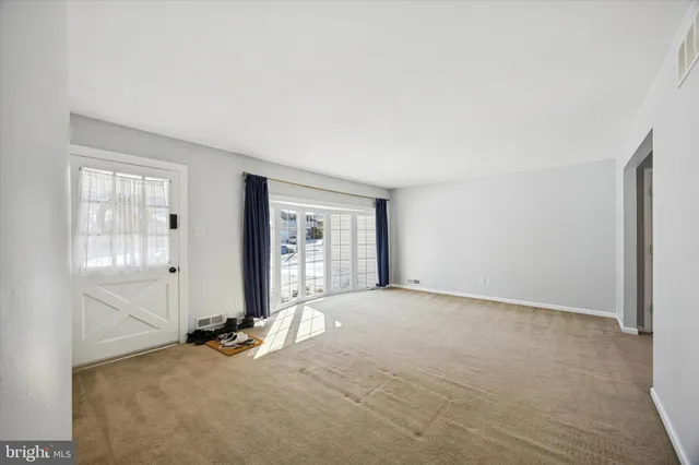 an empty room with windows