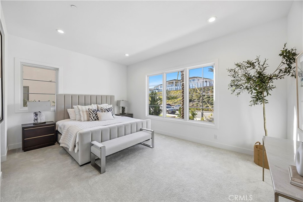 20138 Marlow Lane Porter Ranch, CA 91326 - Photo 11 of 39 a spacious bedroom with a bed and a window