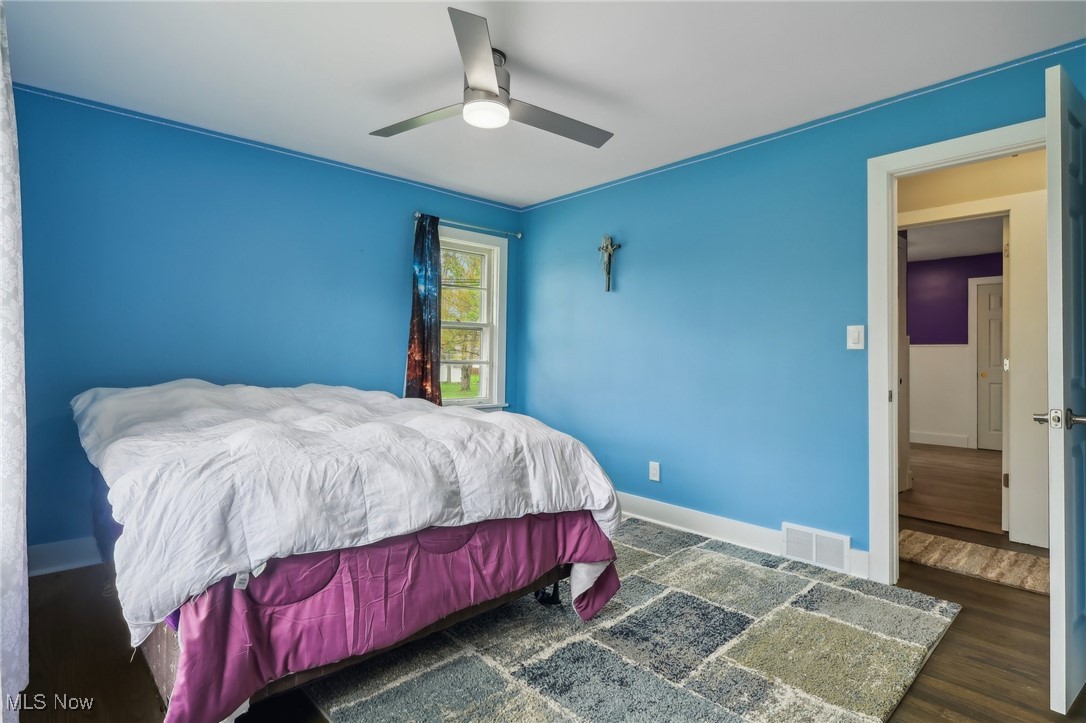13676 Whitney Road Strongsville, OH 44136 - Photo 22 of 46 Bedroom featuring a ceiling fans, wood finished floors, and baseboards