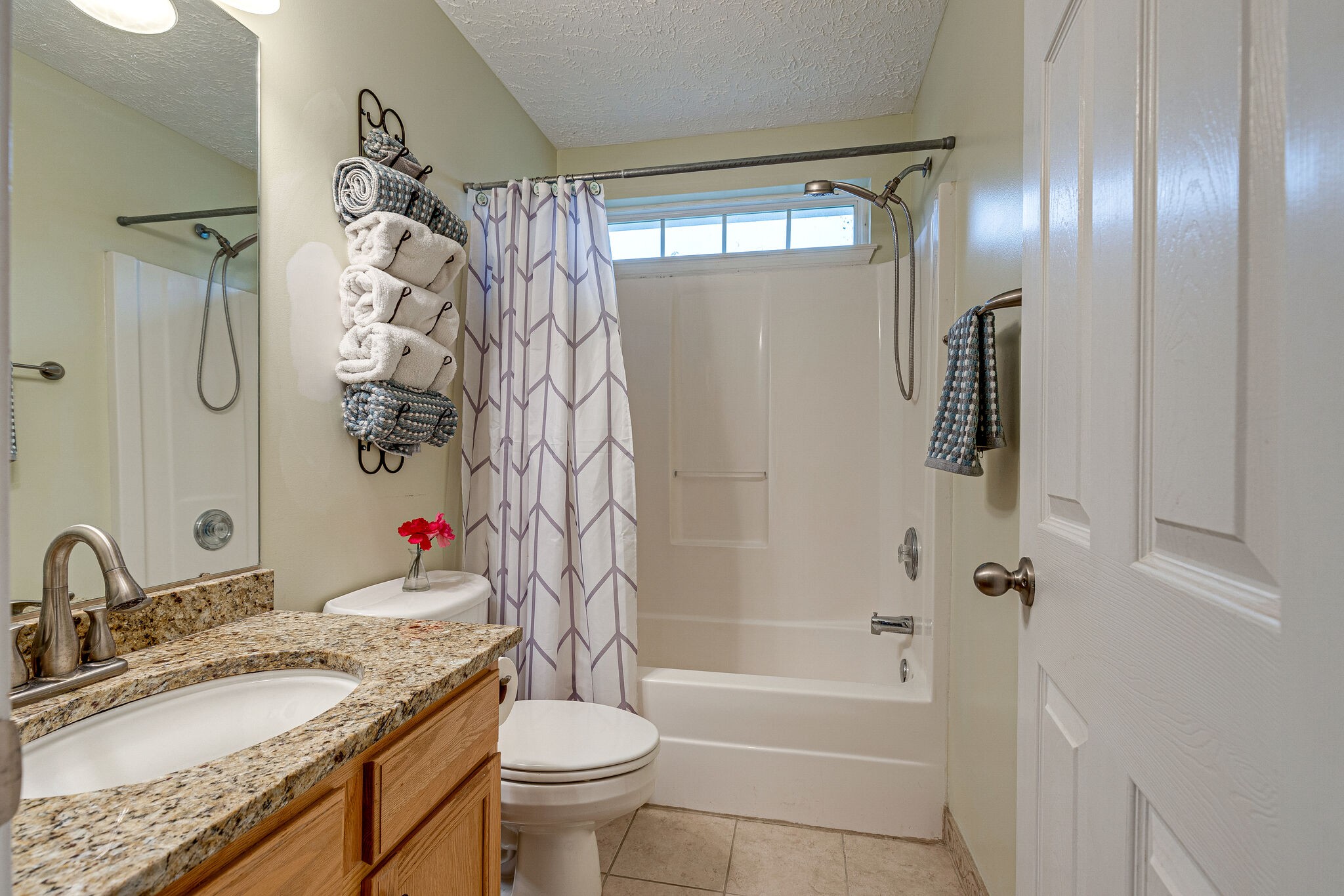 1882 O'Reilly Circle Spring Hill, TN 37174 - Photo 13 of 17 a bathroom with a granite countertop sink toilet and shower
