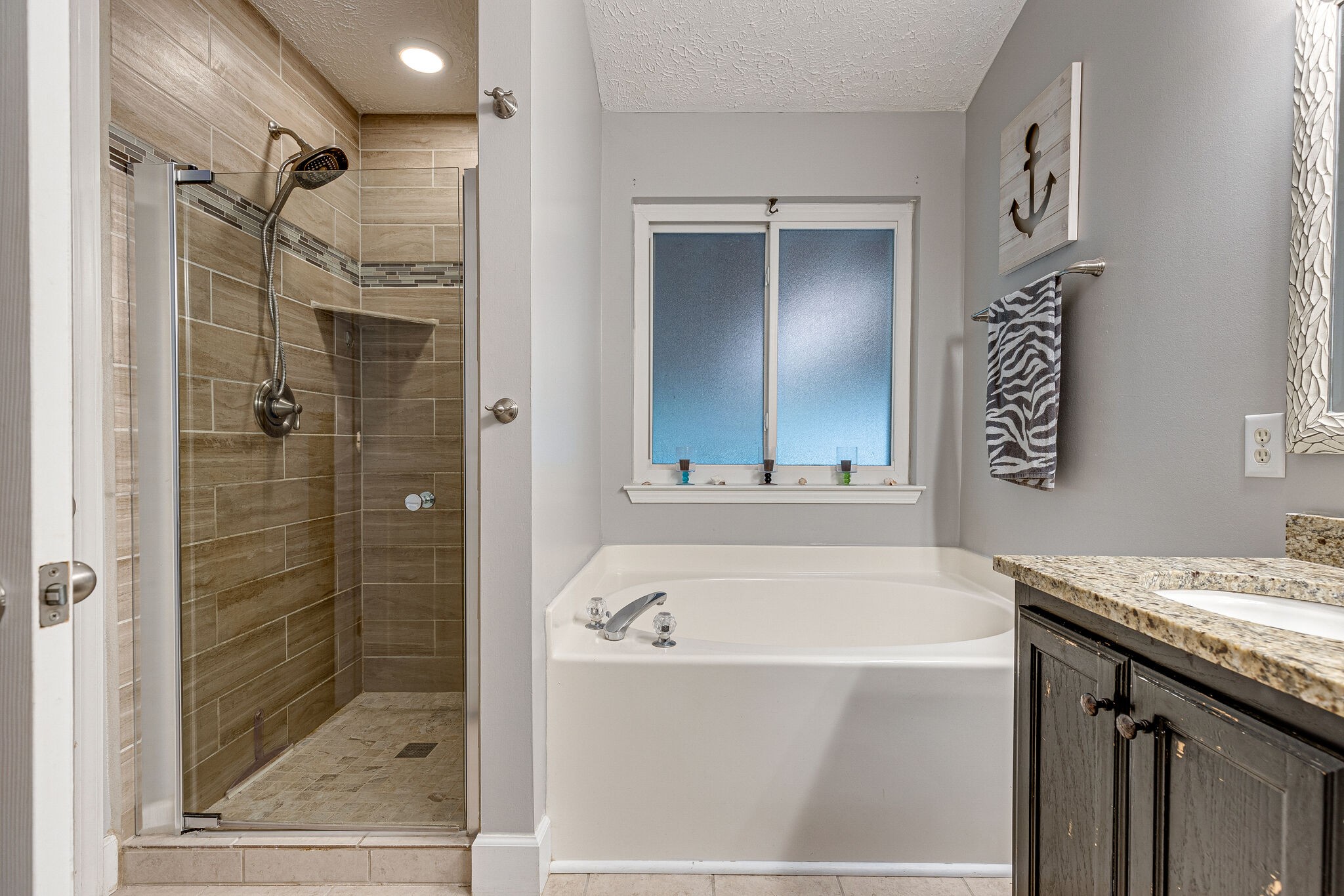 1882 O'Reilly Circle Spring Hill, TN 37174 - Photo 10 of 17 a bathroom with a bathtub and a shower