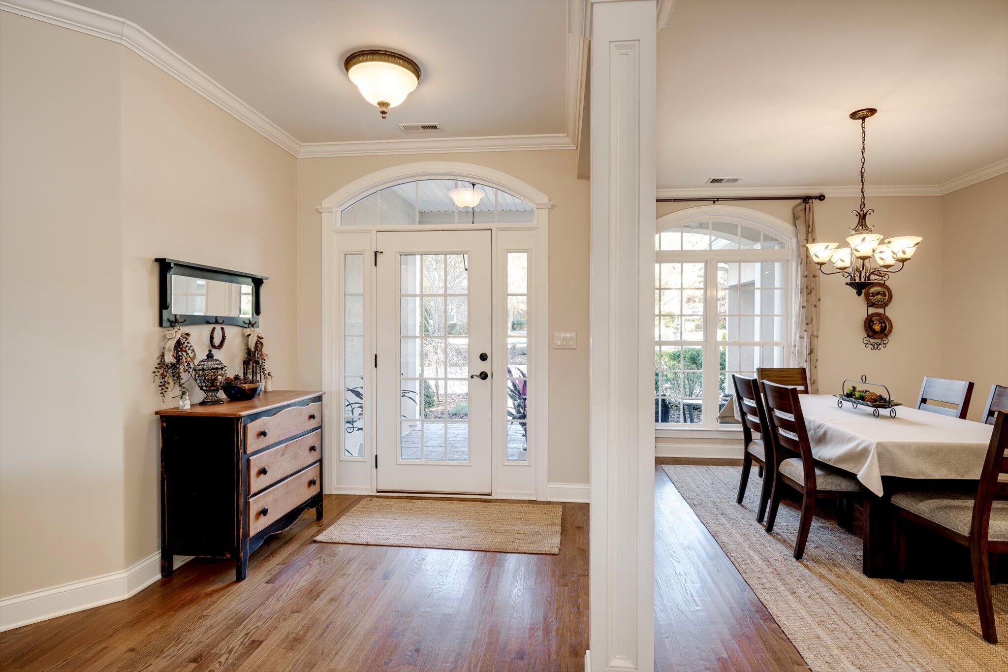 7115 Castlesteads Drive Aiken, SC 29803 - Photo 6 of 60 Divided light front door with arched transom is in keeping with the DR
windows and arched transom.