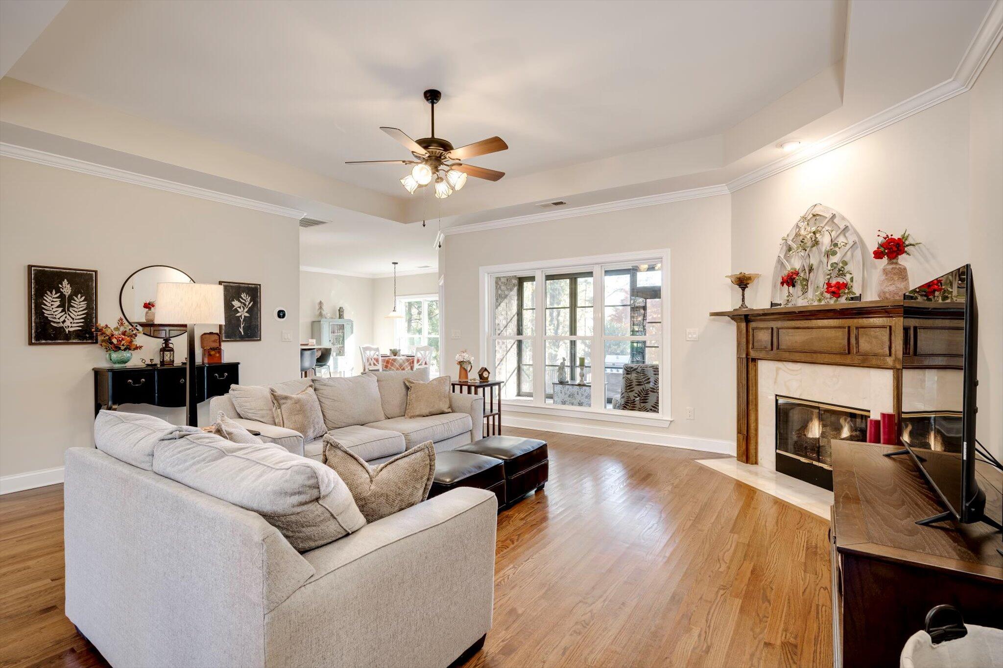 7115 Castlesteads Drive Aiken, SC 29803 - Photo 7 of 60 Floor to ceiling windows provide natural light coming into the sunroom.