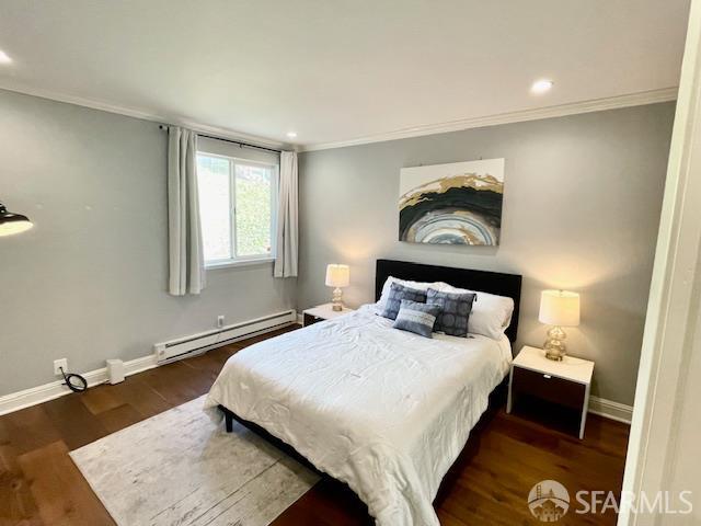 5007 Palmetto Avenue, Unit 37 Pacifica, CA 94044 - Photo 7 of 9 a bedroom with a bed and a painting on the wall