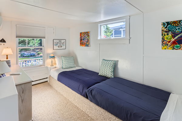 217 Barnes Road Oak Bluffs, MA 02557 - Photo 47 of 60 a bedroom with a bed and painting on the wall
