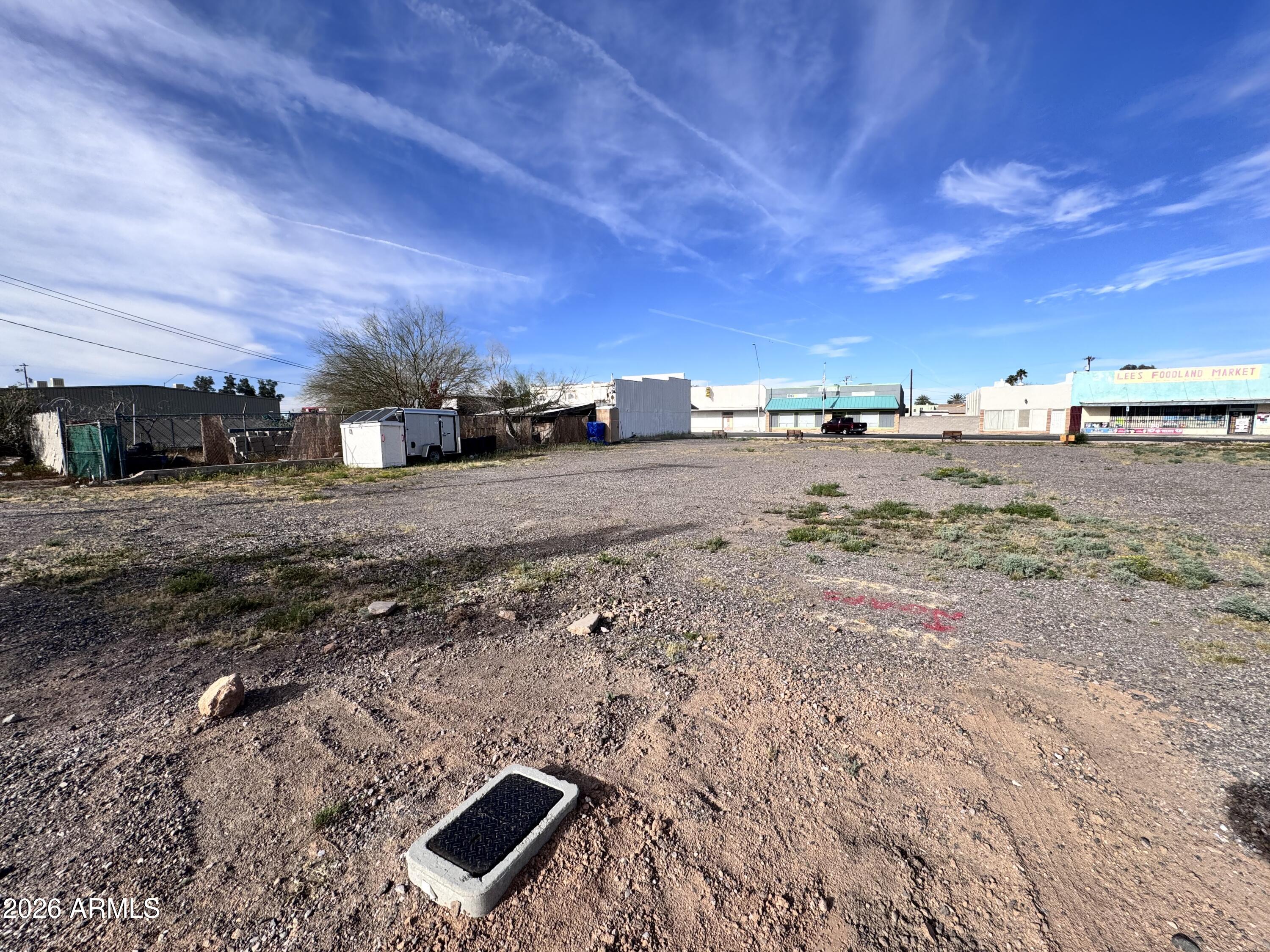 321 South Main Street, Unit 2 Coolidge, AZ 85128 - Photo 12 of 15 a view of a dry yard with wooden fence