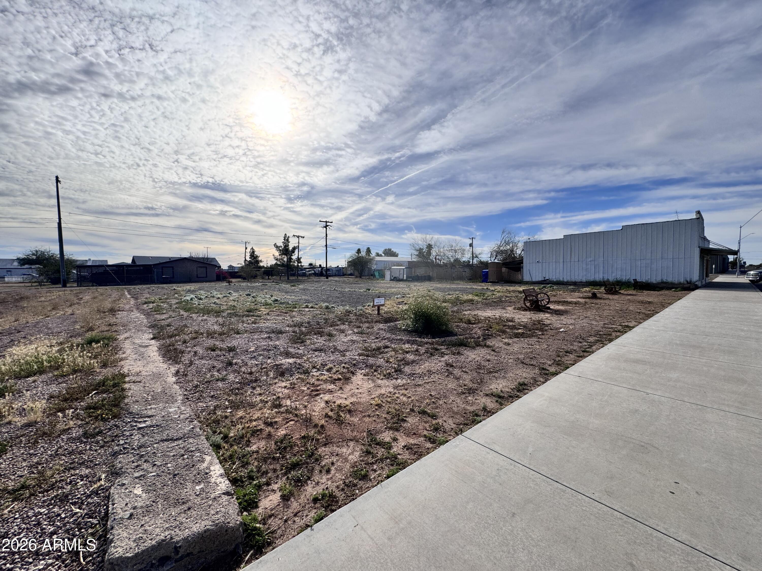 321 South Main Street, Unit 2 Coolidge, AZ 85128 - Photo 3 of 15 a view of a dry yard with wooden fence